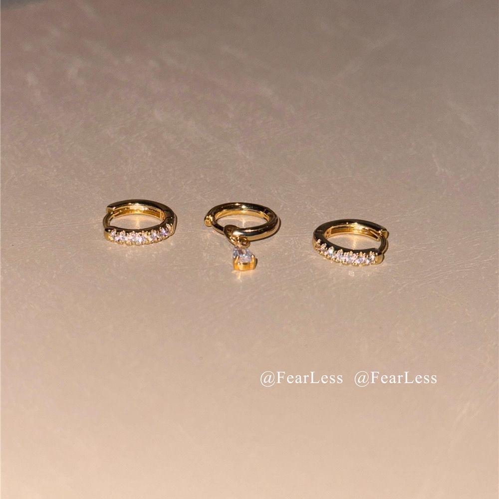 Asymmetrical small design earrings drop-shaped