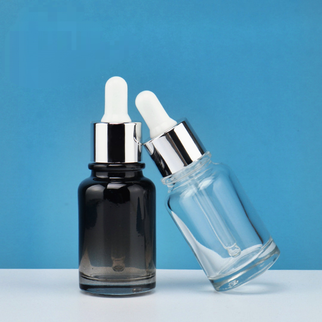 Fábrica en stock al por mayor cilíndrica de fondo grueso botella de aceite esencial botella cosmética 30ml cuentagotas transparente portátil de viaje sub-botella