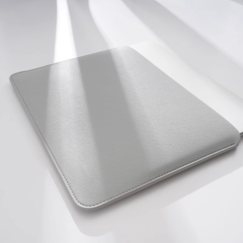 Solid color faux leather tablet laptop sleeve with soft leather and fine texture, suitable for business and commuting, available in multiple sizes