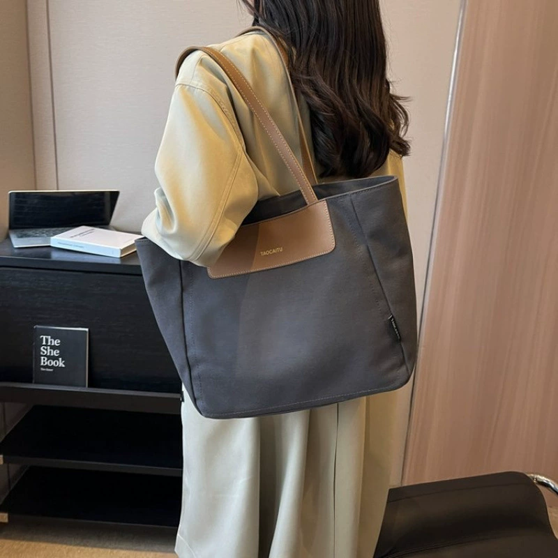 Demi-season universal capacious shoulder bag