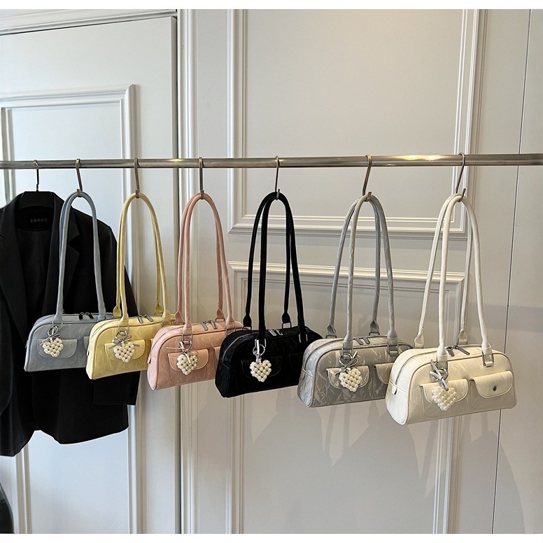 腋下保龄球包包女2025新款韩版简约休闲蝴蝶结枕头包百搭单肩包