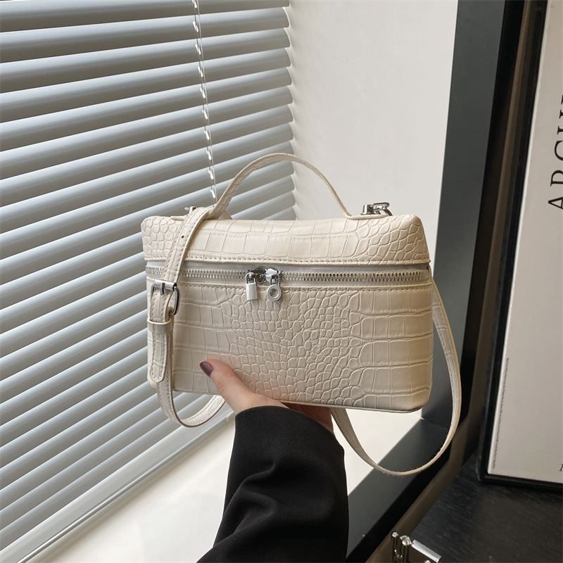 2025 textura simple bolso pequeño portátil nuevo bolso cuadrado pequeño de moda de moda bolso de mensajero de paso de alta gama