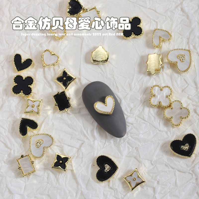 Net Red new fritillary love four-leaf clover nail ornaments alloy shaped imitation fritillary nail accessories wholesale