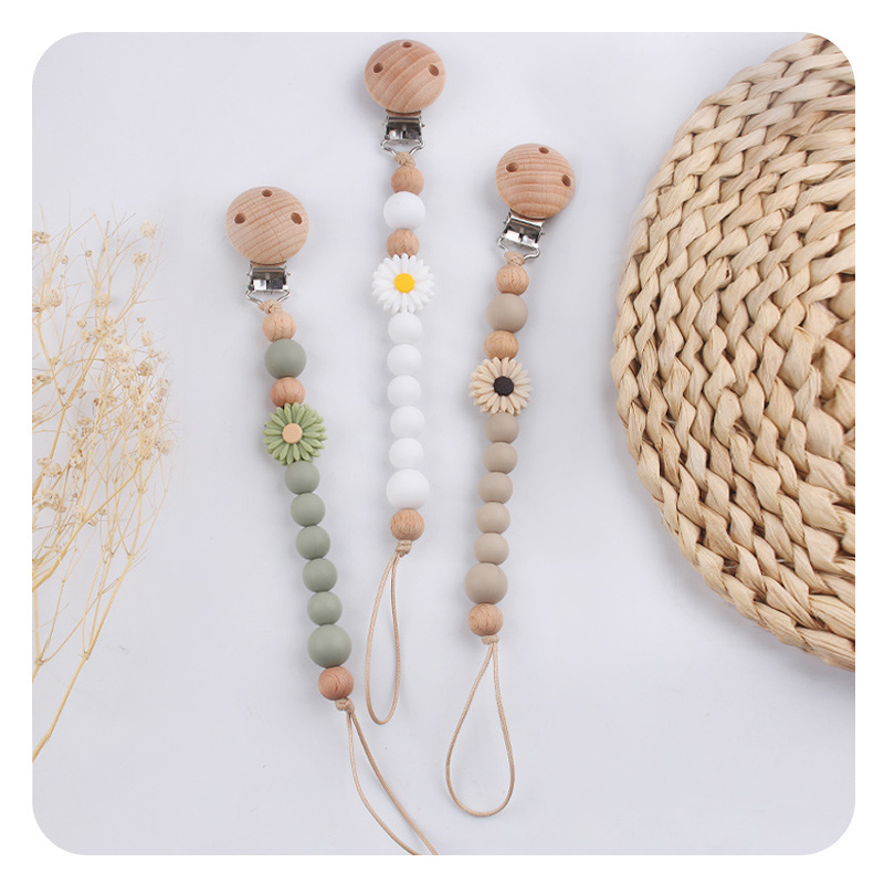 Productos para bebés de madera de haya cadena de tetas de silicona de dibujos animados margarita cuentas para calmar bebés cadena de tetas anti-caída cadena