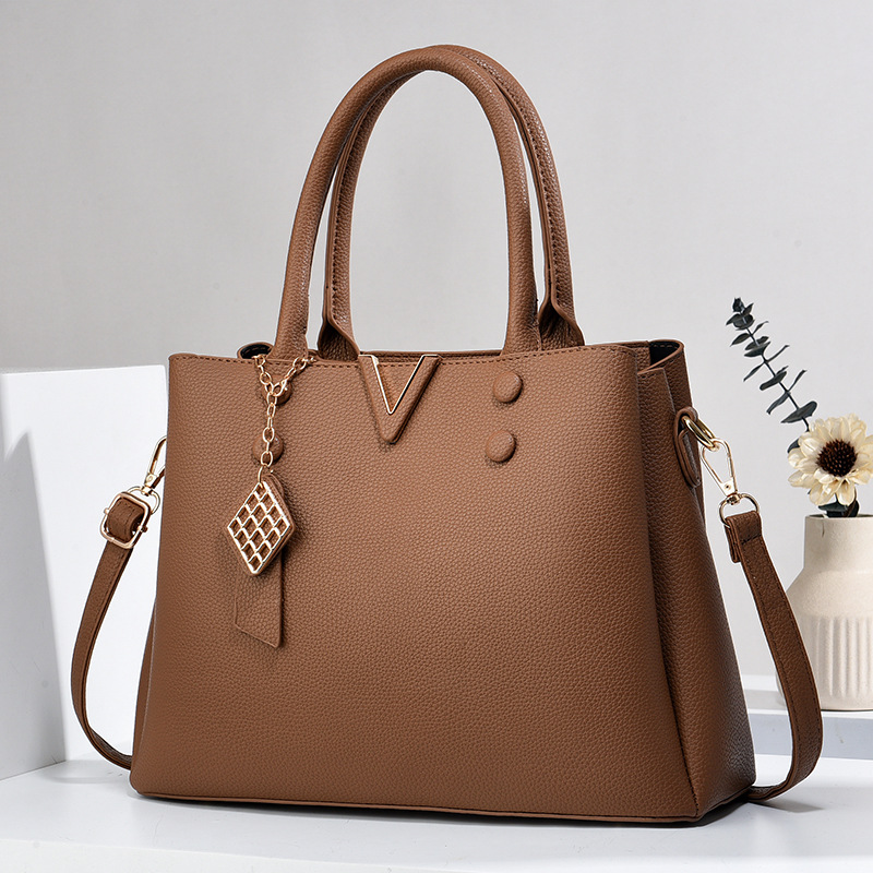 Bolso de mujer explosivo 2025 fábrica de comercio exterior nuevo bolso de hombro de verano atmósfera bolso de moda universal