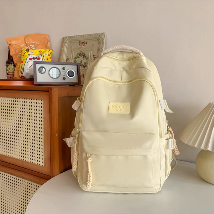Рюкзак через плечо, корейская версия, однотонный, сверхлегкий, большой вместимости, милый, универсальный, простой, модный, школьный рюкзак для учащихся средних школ и женщин.