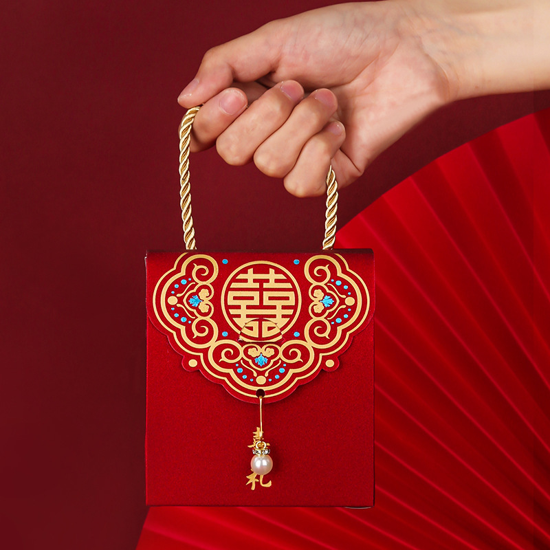 Caja de dulces de boda china Bolsa de dulces de boda Recuerdos de boda Caja de dulces de mano creativa Caja de dulces de boda de vuelta