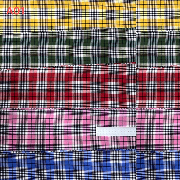 21支涤棉70/30色织磨毛格子布春夏衬衫面料 140克涤棉公仔布台布