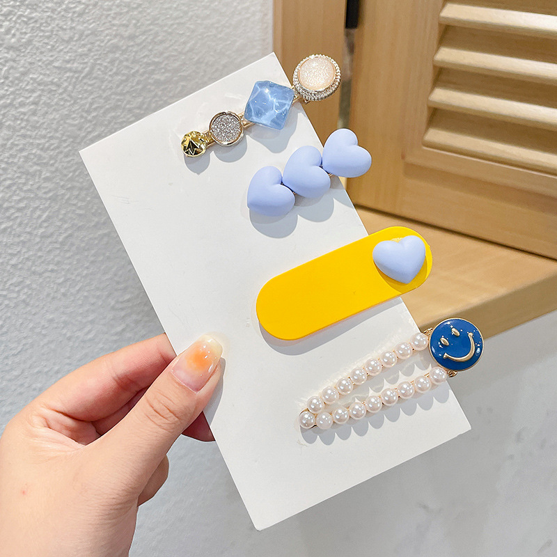 Clip de flequillo lateral rojo de la red femenina 2025 nueva horquilla simple clip de una línea horquilla clip de cabello roto tocado clip de pico de pato