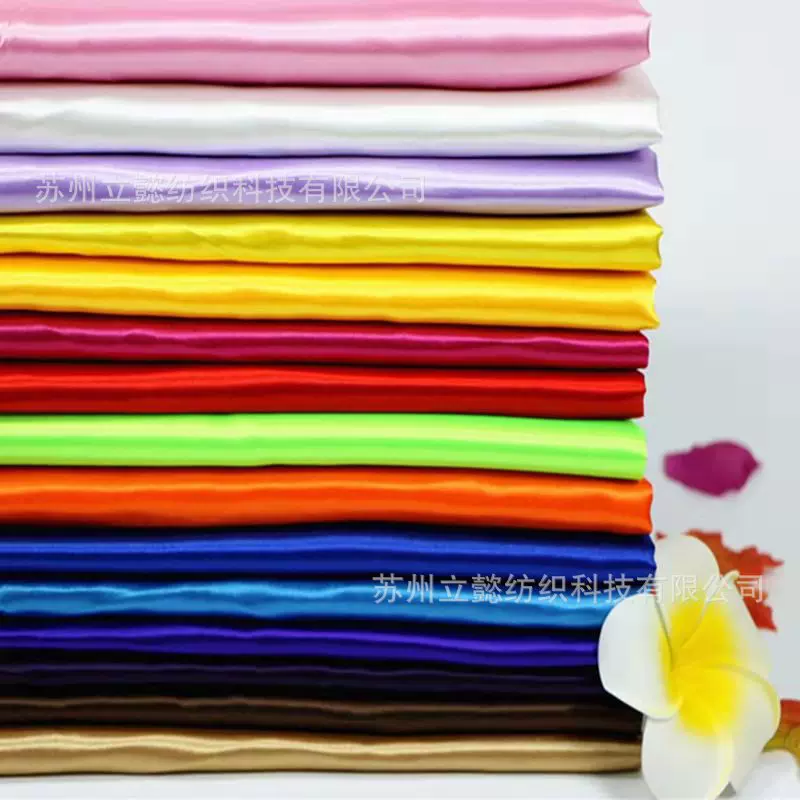 厂家直销全涤纶斜纹布装饰演出服装里料包边布节日服面料高密色丁