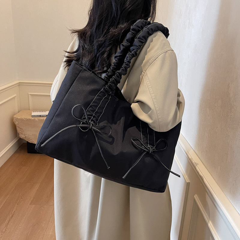 Bolsa de hombro de nicho coreano, bolso de viaje de arco, bolso de mano de mujer, bolso casual de gran capacidad, simple.