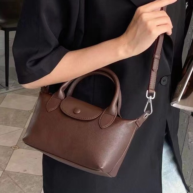 Bolsos femeninos 2024 nuevos bolsos femeninos de cuero de alta costura de moda 100 bolsos correccionales para viajeros de nicho bolsos portátiles