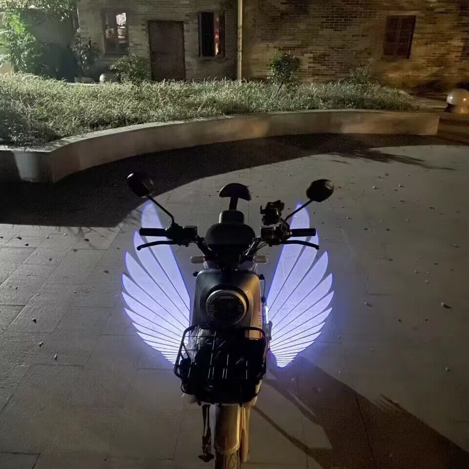 Venta directa de fábrica de luces de piso para motocicletas, luces de proyección de alas de ángel, luces de bienvenida, luces de alfombra, luces ambientales generales modificadas