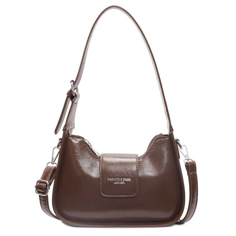 Nicho Zhong simple y versátil bolso de brazo para mujeres 2025, nuevo estilo de moda casual bolso de hombro de alta sensación bolso de media luna de mano