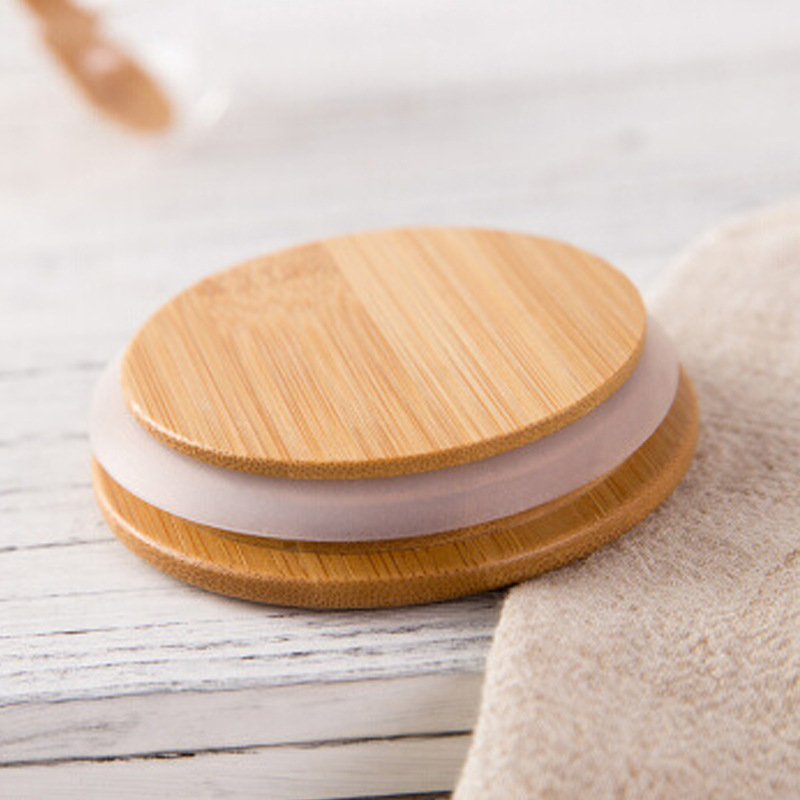 Venta al por mayor tarro de té resistente al calor de vidrio sellado tarro transparente frasco de almacenamiento de fruta seca botella de almacenamiento de bocadillos tarro de caramelo tapa de Bambú