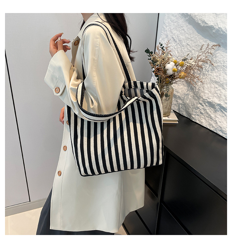 2024 Autumn/Winter new versatile and fashionable striped handbag shopping bag, two-tone large-capacity trendy single-shoulder bag undefined