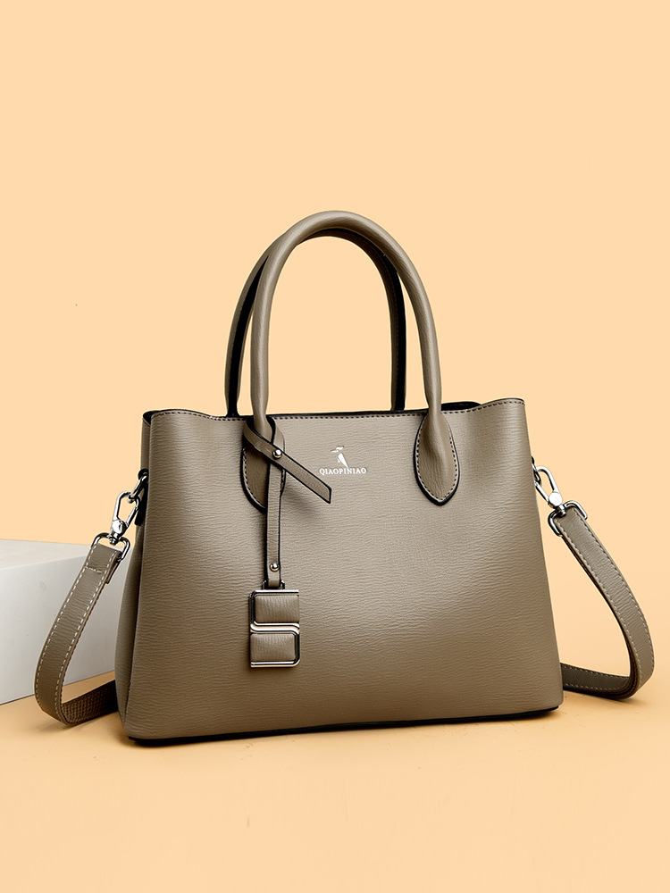 Nuevo bolso de mujer simple de moda, bolso de mano de cuero suave de gran capacidad, bolso de tela de mujer, bolso de canguro