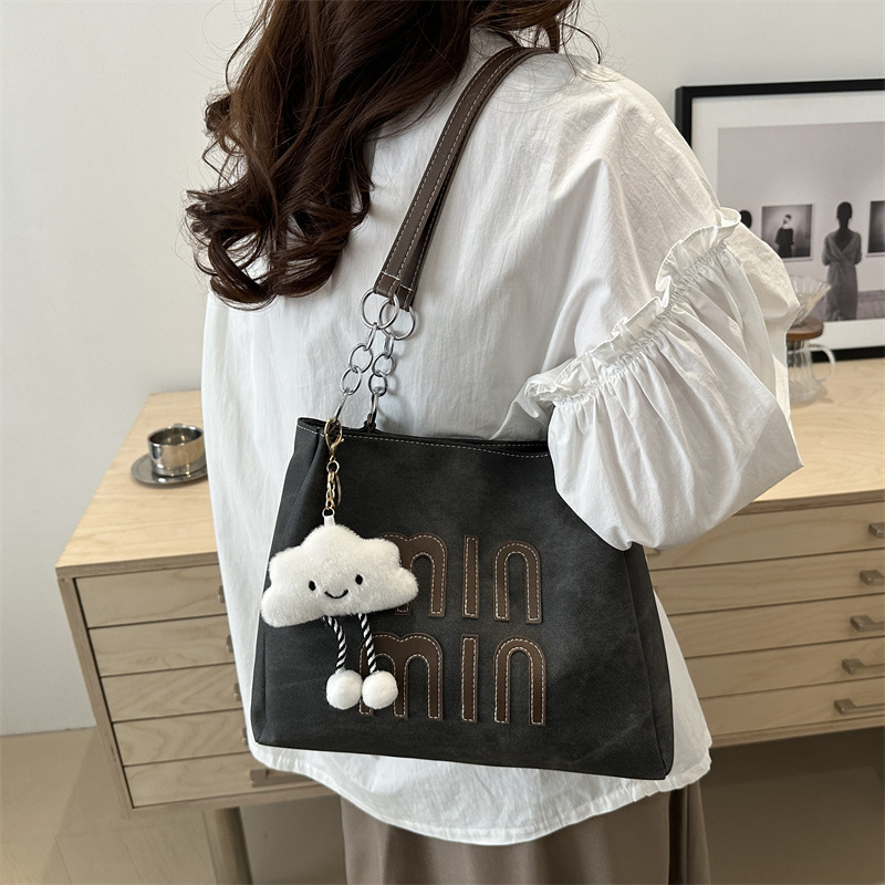 Este año, la versión coreana retro popular bolso de brazo para mujeres 2024 nueva moda bolso de mano casual personalidad textura bolso especial