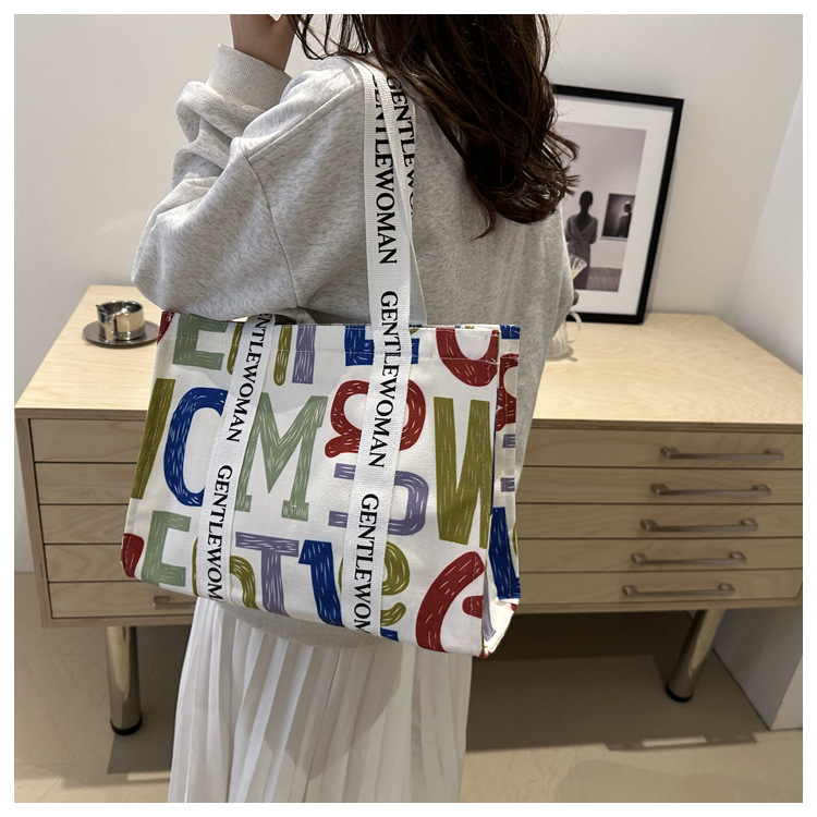 Large-capacity letter canvas bag 2025 new style ins printed versatile shoulder bag for commuting and portable ladies' tote bag undefined