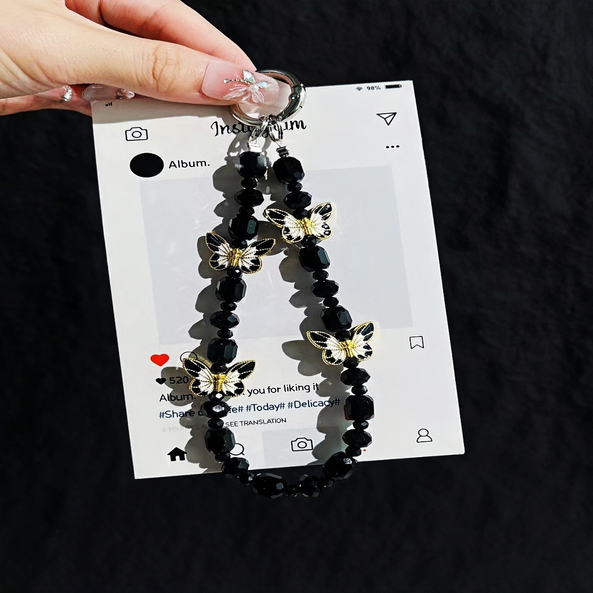 Cadena de teléfono móvil al por mayor cadena de cuentas de cristal flor de mariposa sentido de alta gama cadena corta hecha a mano para mujer bolsa de viento NIS todo fósforo