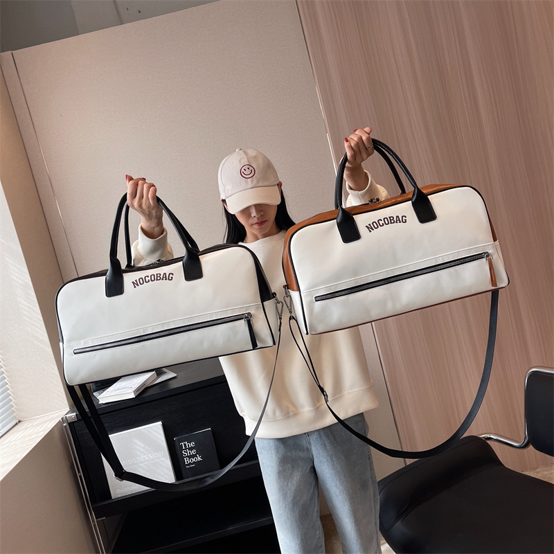 Bolsa de equipaje de gran capacidad de viaje de negocios de corta distancia Nueva bolsa de viaje de color de contraste de moda bolsa de almacenamiento de ropa portátil simple de un hombro