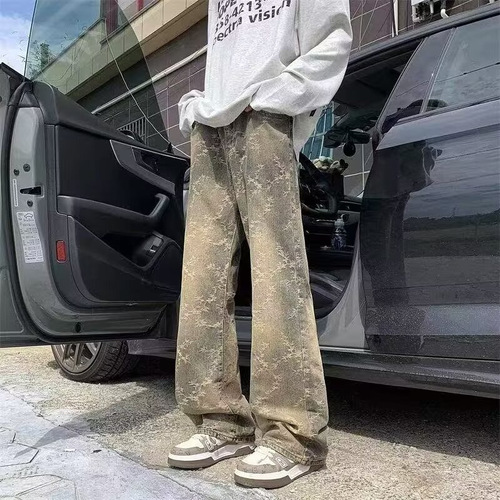 American-style high-street vibe camo tie-dye denim jeans for men: loose-fit, casual, washed-out look with dramatic ink-splashed, vintage-inspired drop-crotch design.