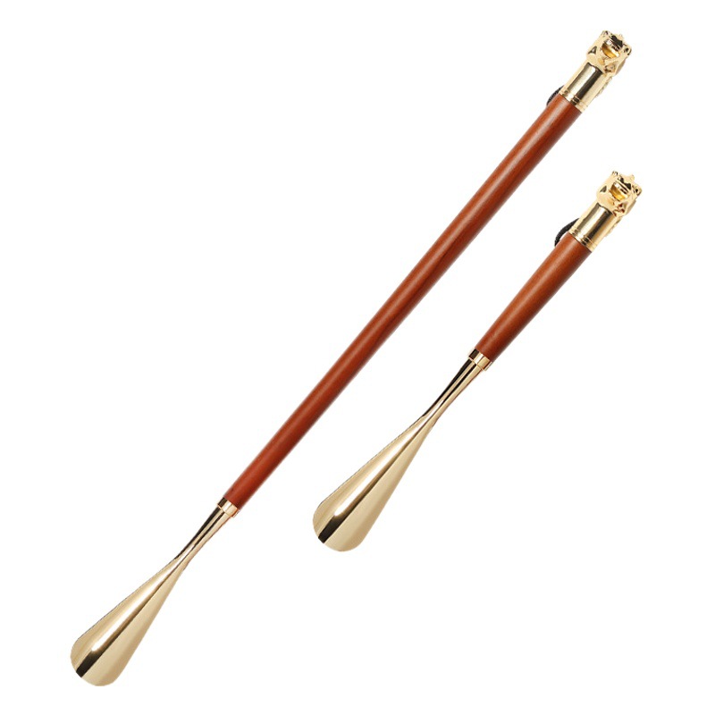 Suministro de haya nuevo estilo caballo dedo del pie del zapato Extractor de zapatos de metal zapato extractor alargado León dedo del pie del zapato de regalo de gama alta