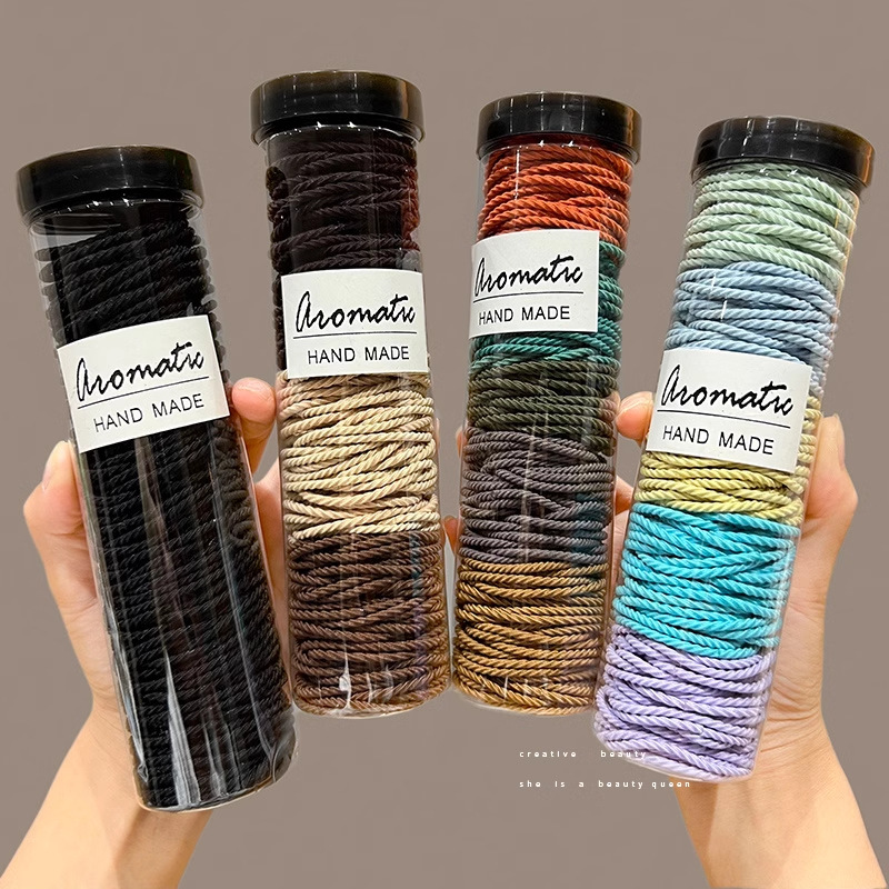 Cabeza de alta sensación de cuerda elástica alta correa de goma duradera de cola de caballo alta anillo de cabello temperamento cuerda de cabello enlatada al por mayor