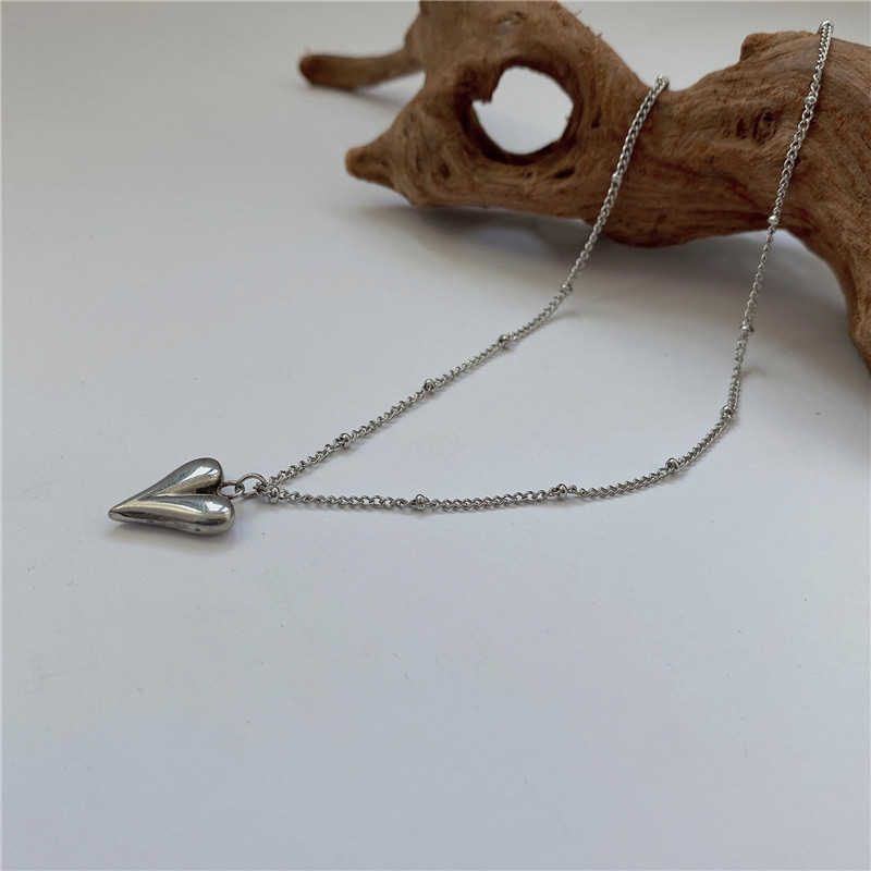 Collier long pendentif cœur géométrique vintage pour femme_voghion.com