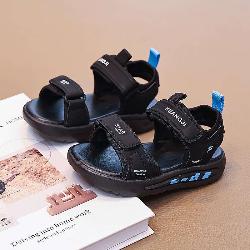 Niños huecos zapatos de playa de dedo abierto 2026 verano nuevo estilo de moda infantil sandalias versátiles sandalias de niños mayores