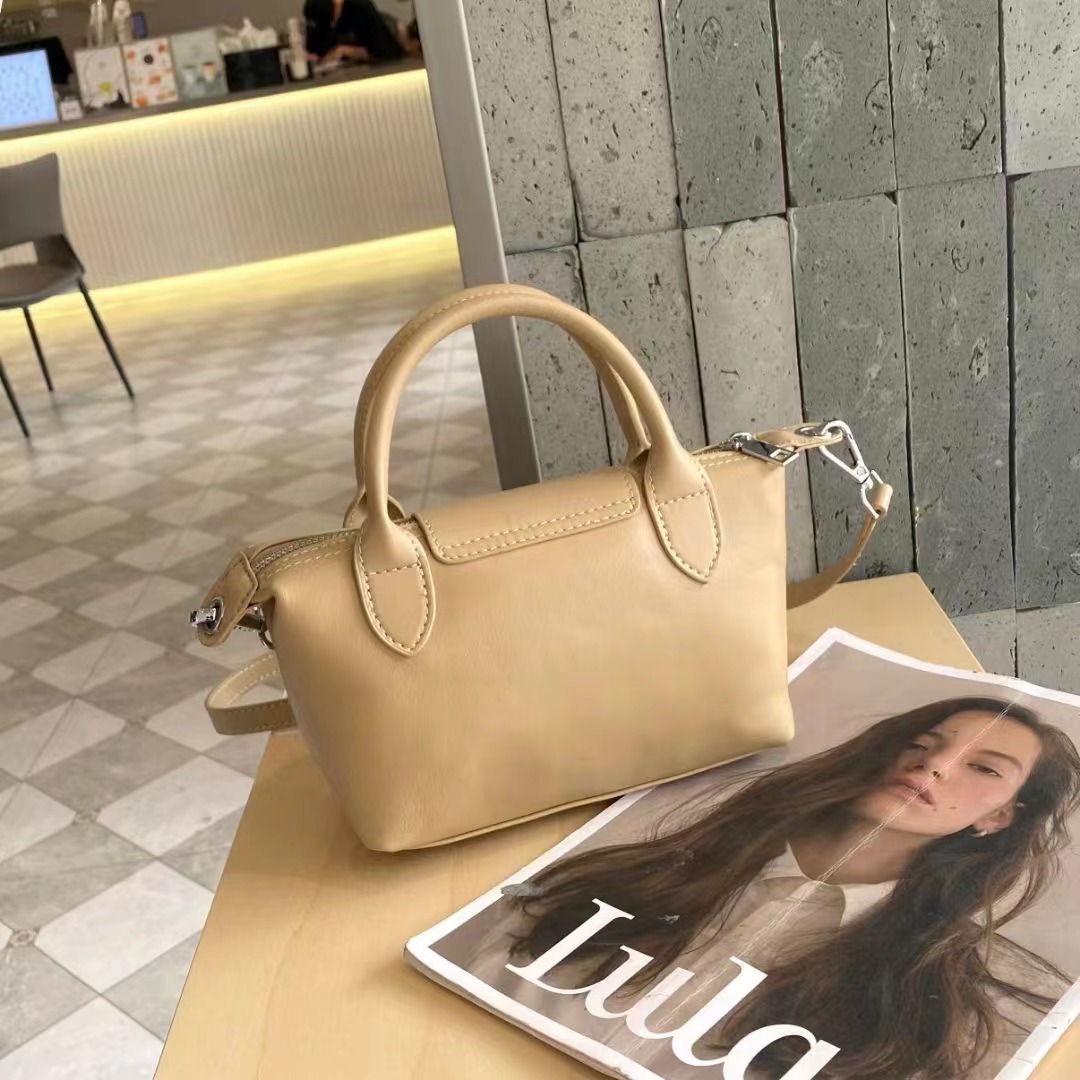 Bolsos femeninos 2024 nuevos bolsos femeninos de cuero de alta costura de moda 100 bolsos correccionales para viajeros de nicho bolsos portátiles