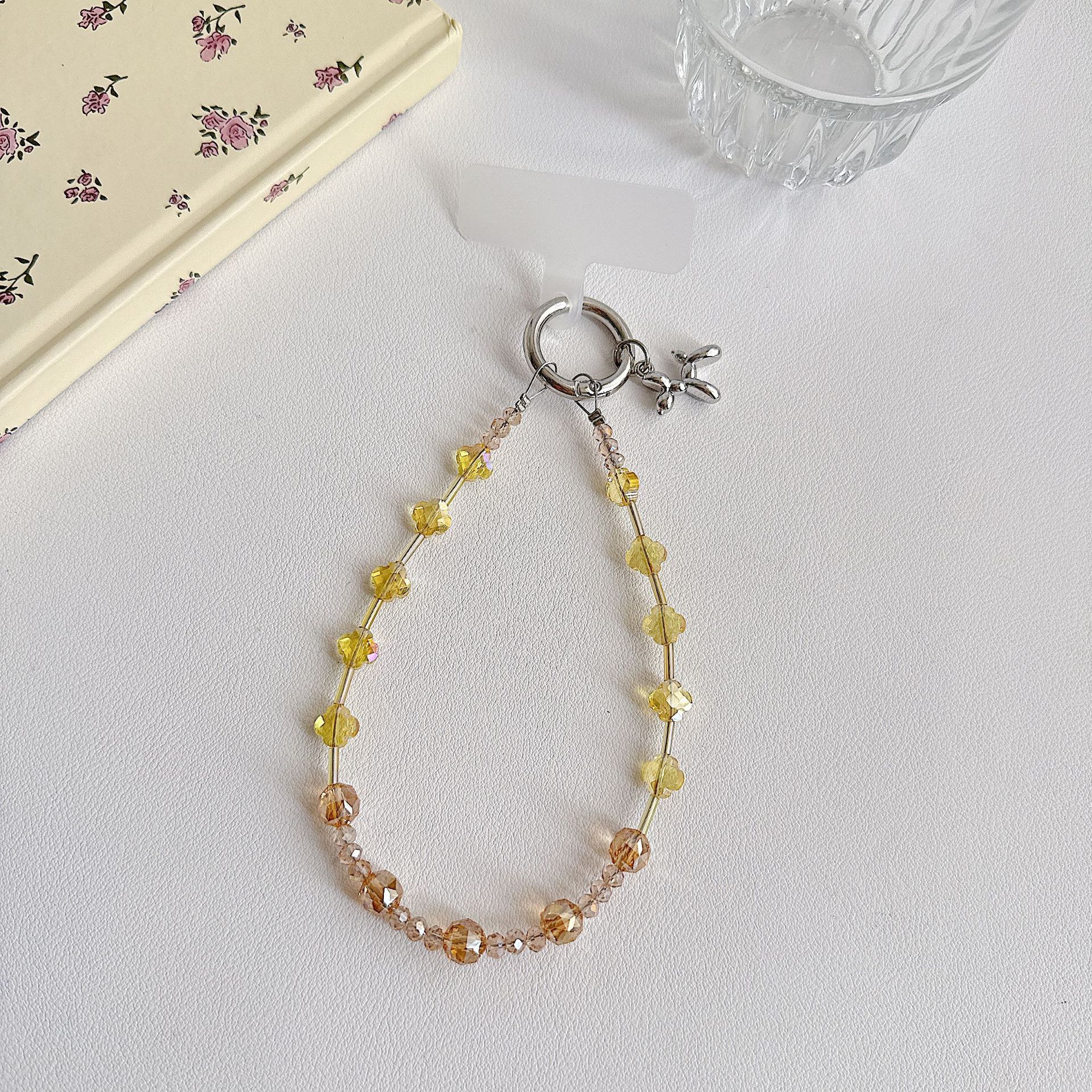 Boutique hecho a mano de alta gama para teléfono móvil cadena de muñeca de trébol de cuatro hojas de cristal original cadena de teléfono móvil de moda cuerda corta