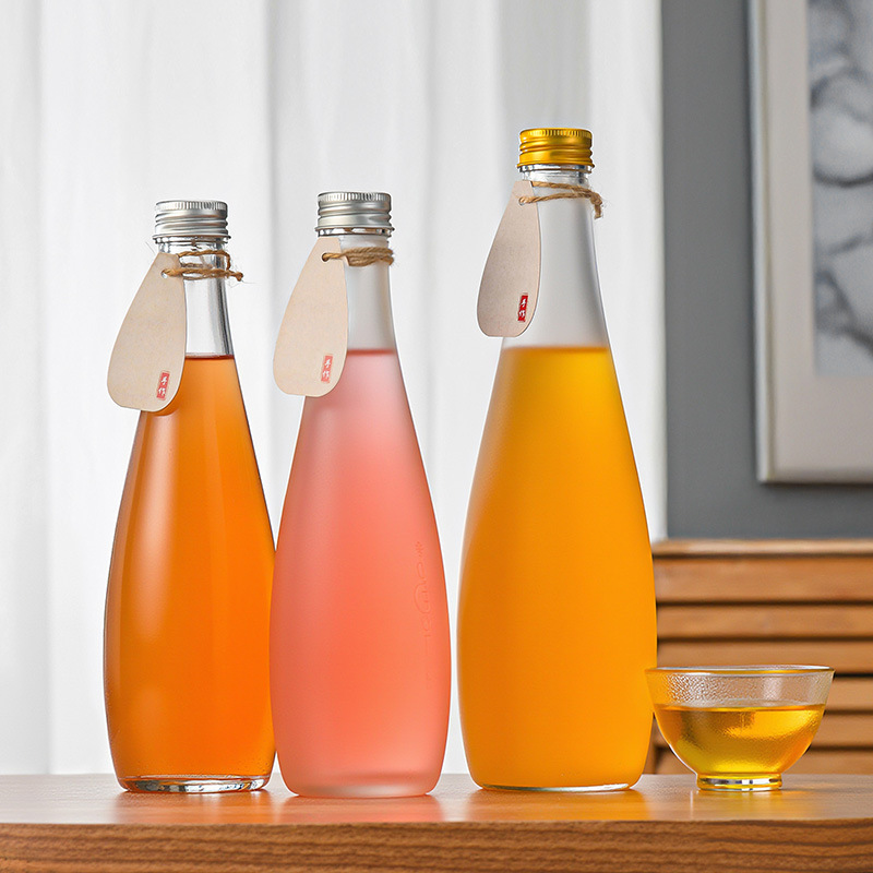 卸売厚みのあるつや消しミネラルウォーターボトル透明ガラスボトル蓋付き密封ジュースソーダ飲料ボトル|undefined
