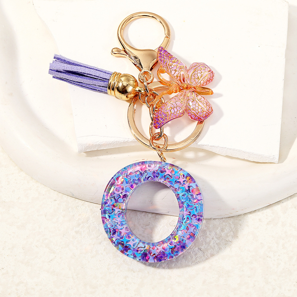 Mayorista transfronterizo mariposa esquinilla iniciales llavero de cristal goteo llavero de letras bolsos colgante