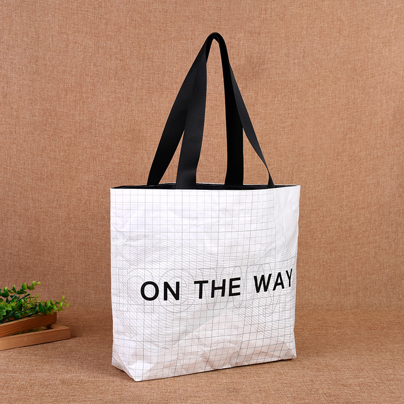 简约欧美风白色杜邦纸袋批发 服装饰品通用购物包装袋 学生装书袋