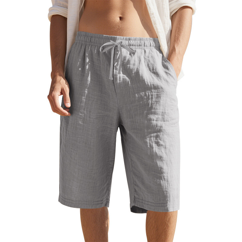 Estación independiente de lino transfronterizo cuerda elástica cintura recta piernas TK color sólido transpirable playa diaria siete puntos pantalones cortos casuales para hombres