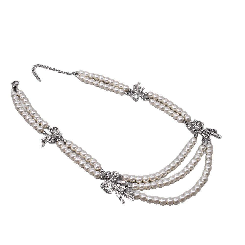 Collana multiriga stile francese con perle e fiocco in strass_voghion.com