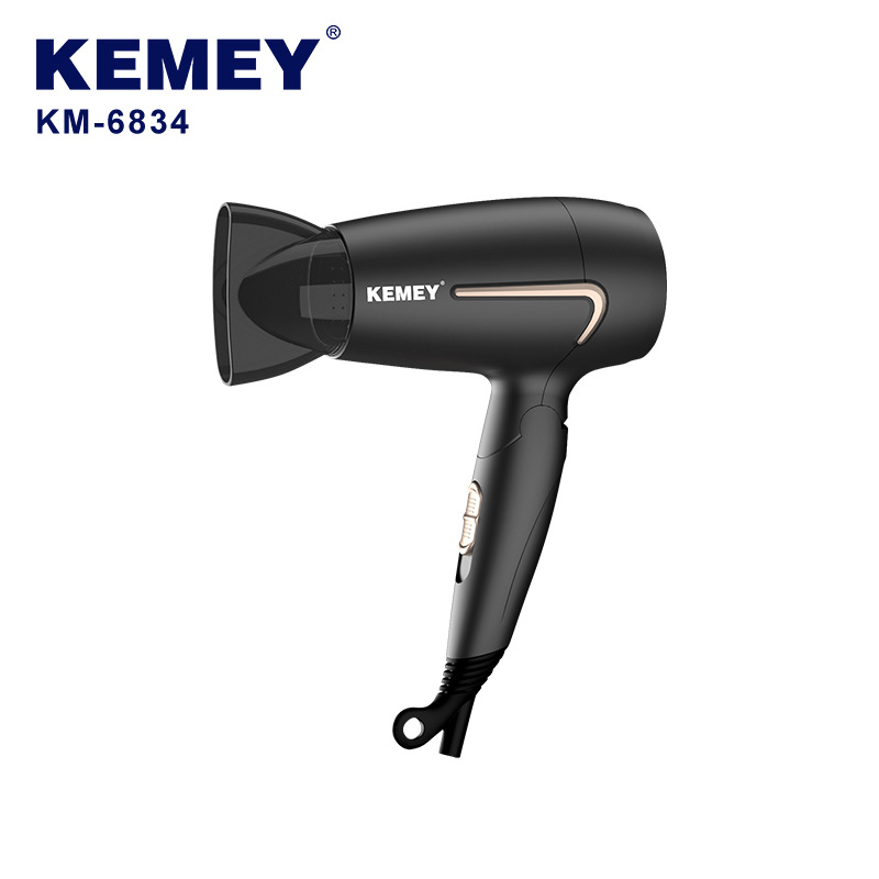 Secador de pelo eléctrico Kemei con viento fuerte y funcionamiento silencioso para uso doméstico, secador de pelo pequeño y plegable KM-6834.