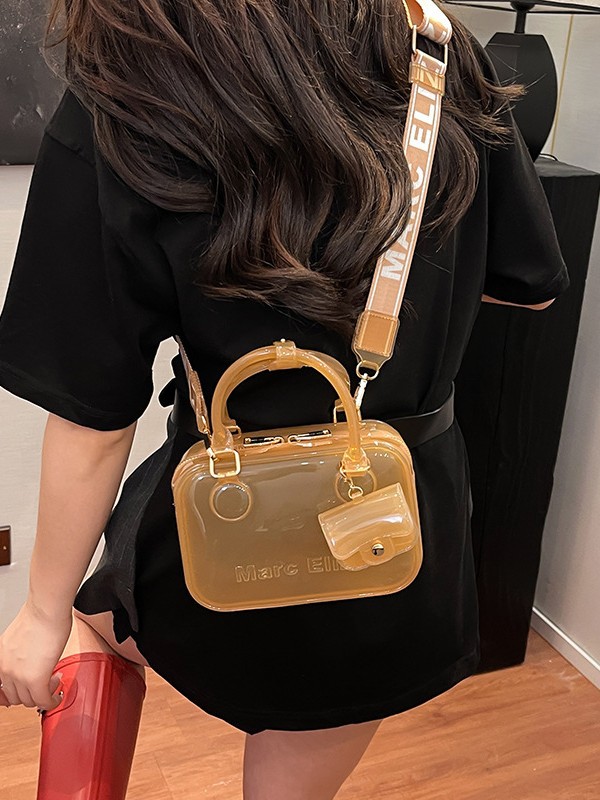 Estilo occidental transparente casual moda gelatina portátil pequeño bolso cuadrado femenino 2025 nuevo bolso bandolera de alta gama de todo fósforo