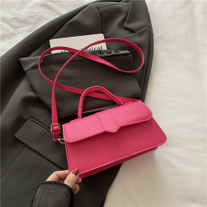 Bolso de color sólido de diseño de nicho para mujer 2025 nuevo bolso cuadrado portátil de moda de moda bolso de mensajero de alta gama de todo fósforo