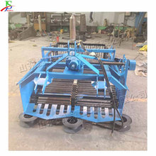 小型液压牵引式捡石机 农田土块碎石清理机 田间管理碎石收集机