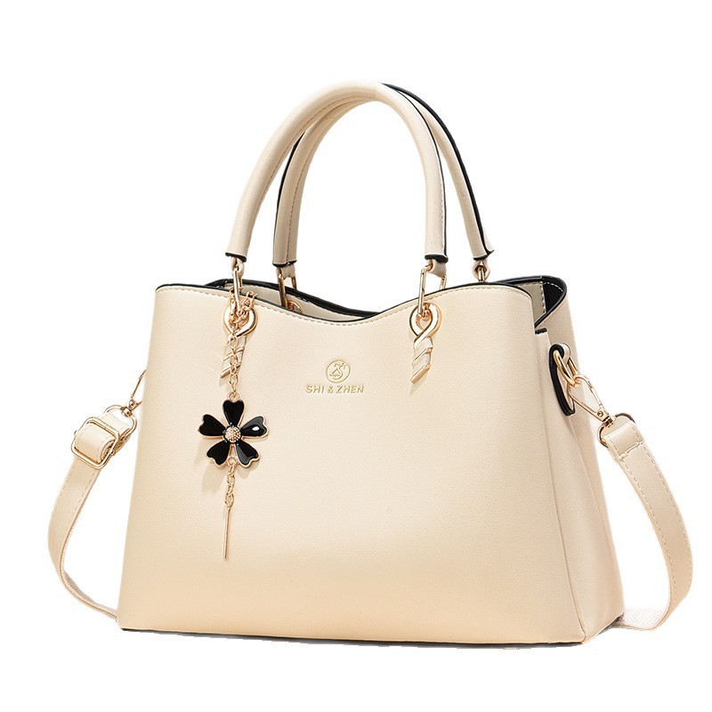 Colgante de flores bolsas de mano de color sólido de gran capacidad de moda versátil bolsas de hombro ocio de viaje oblicuo bolsas transfronterizas