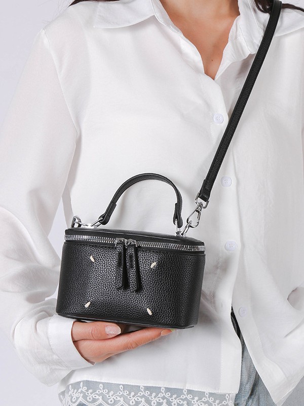 Bolso de caja de estilo occidental de color puro para mujer 2025 nuevo bolso cuadrado pequeño de moda de moda bolso de lonchera de mensajero de un solo hombro de sentido de alta gama