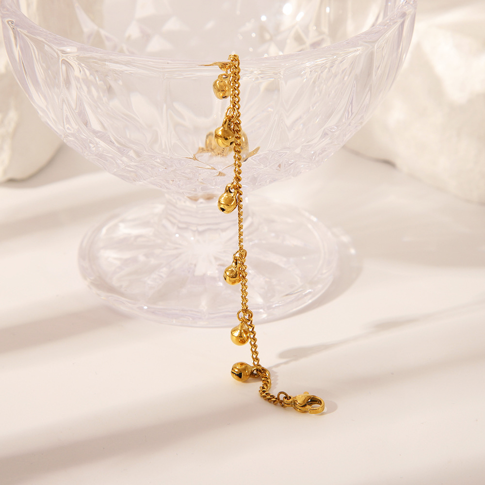 Estilo étnico transfronterizo europeo y americano, campana de nicho simple hecha a mano, tobillera, personalidad de moda femenina, adornos para pies de acero de titanio chapado en oro de 18K