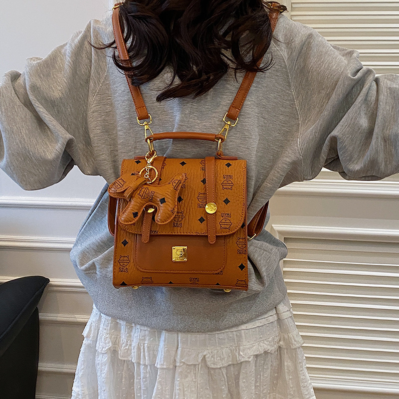 Mochila de moda coreana para mujer, bolso de mensajero con estampado de moda ringge de estilo occidental, bolso de viaje con colgante de cachorro lindo