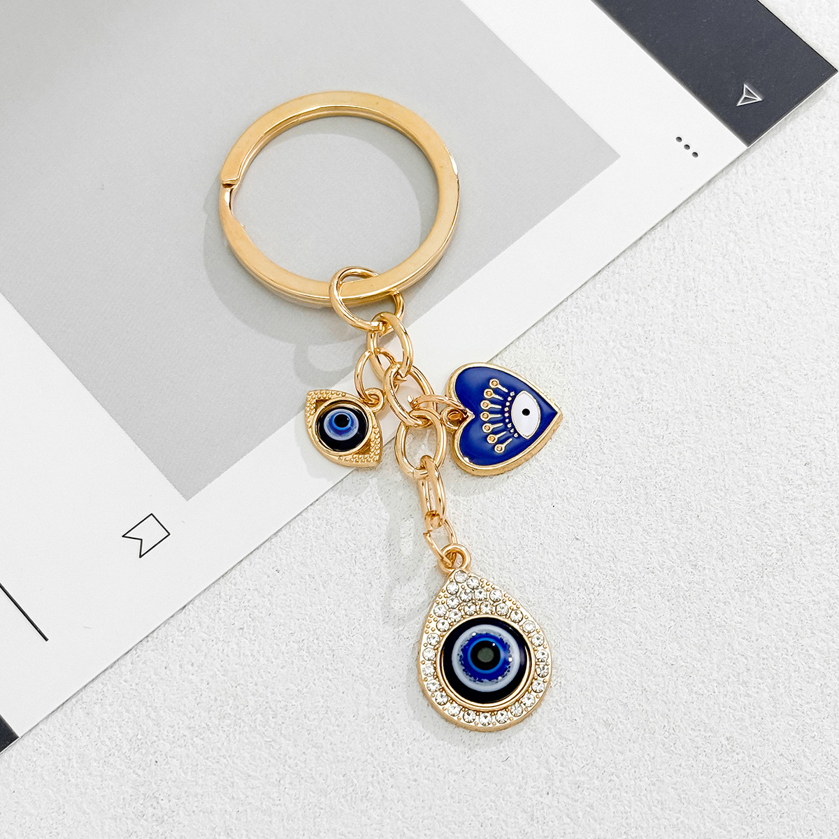 Cross-Border Hot Sale New Heart-Shaped Palm Water Drop Evil Eye Pendant Accessories Keychain Key Ring Manufacturer_voghion.com