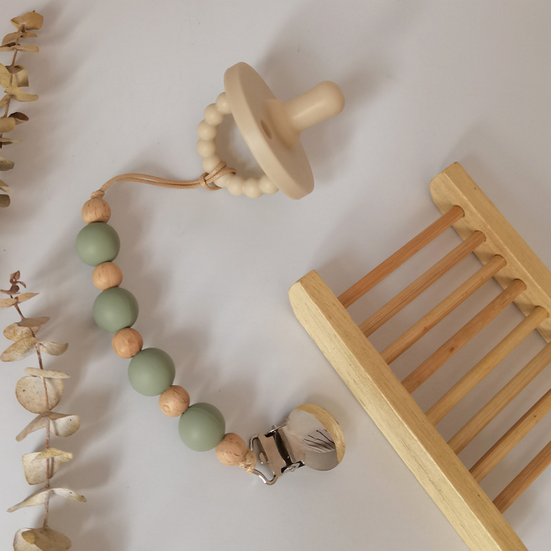 Nuevo bebé suministros de silicona perlas Cadena de pezón calmante bebé DIY creativo mordedura molar cadena anti-caída