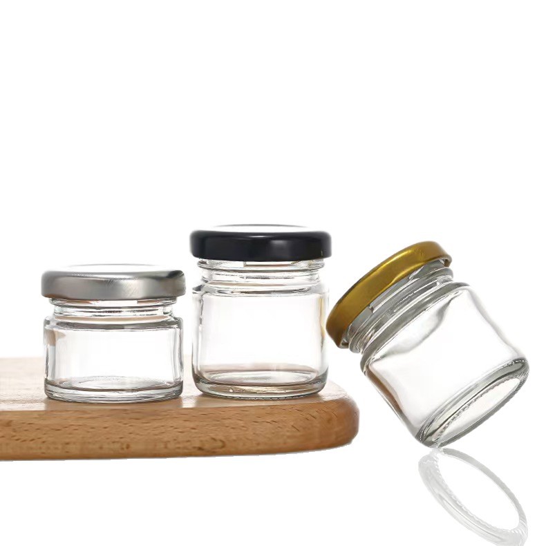 Inventario multi-especificaciones de latas de sellado transparentes de vidrio de seis bordes de miel botella de mermelada para probar mini pequeña botella de miel