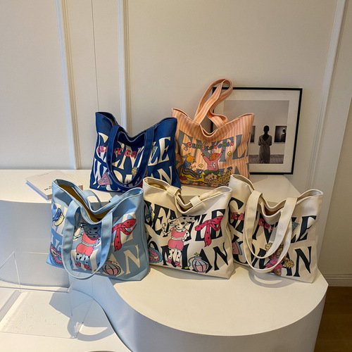 字母印花帆布单肩包包女大容量卡通托特包可爱少女通勤手提包跨境