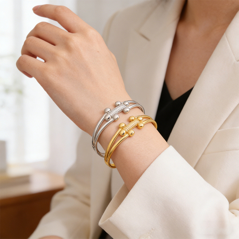 Brazalete de acero inoxidable de moda transfronteriza europea y americana lujo ligero de alto nivel sensación de bolas pequeñas h brazalete de apertura de oro mujer al por mayor